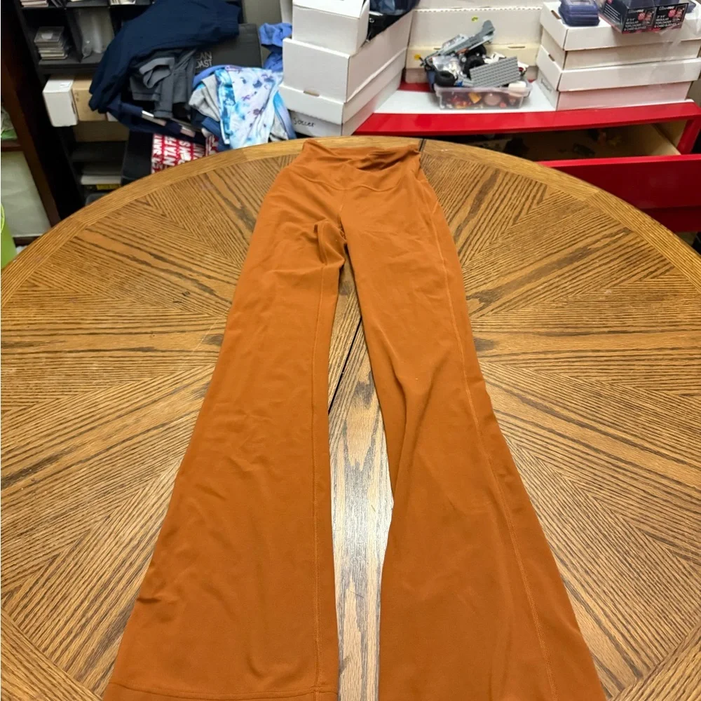 lululemon athletica Burnt Orange Flare Leggings - Picture 1 of 8
